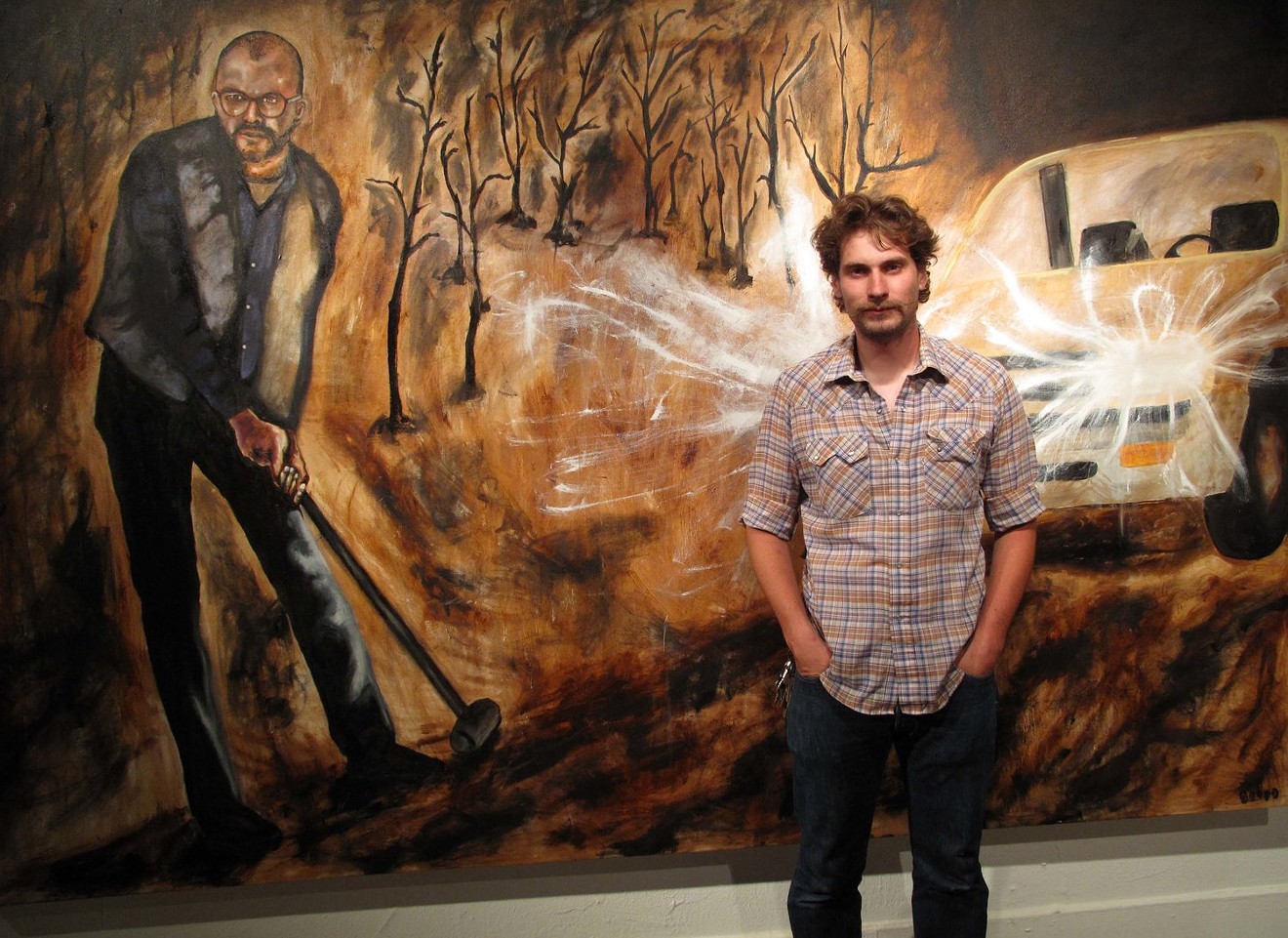 Denver artist Terry Campbell poses for Ken Hamel with his work.
