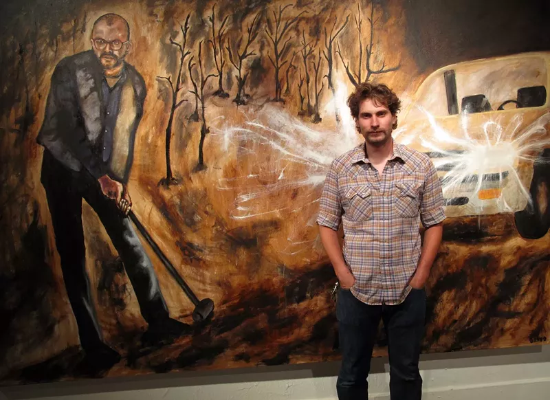 Image: Denver artist Terry Campbell poses for Ken Hamel with his work.