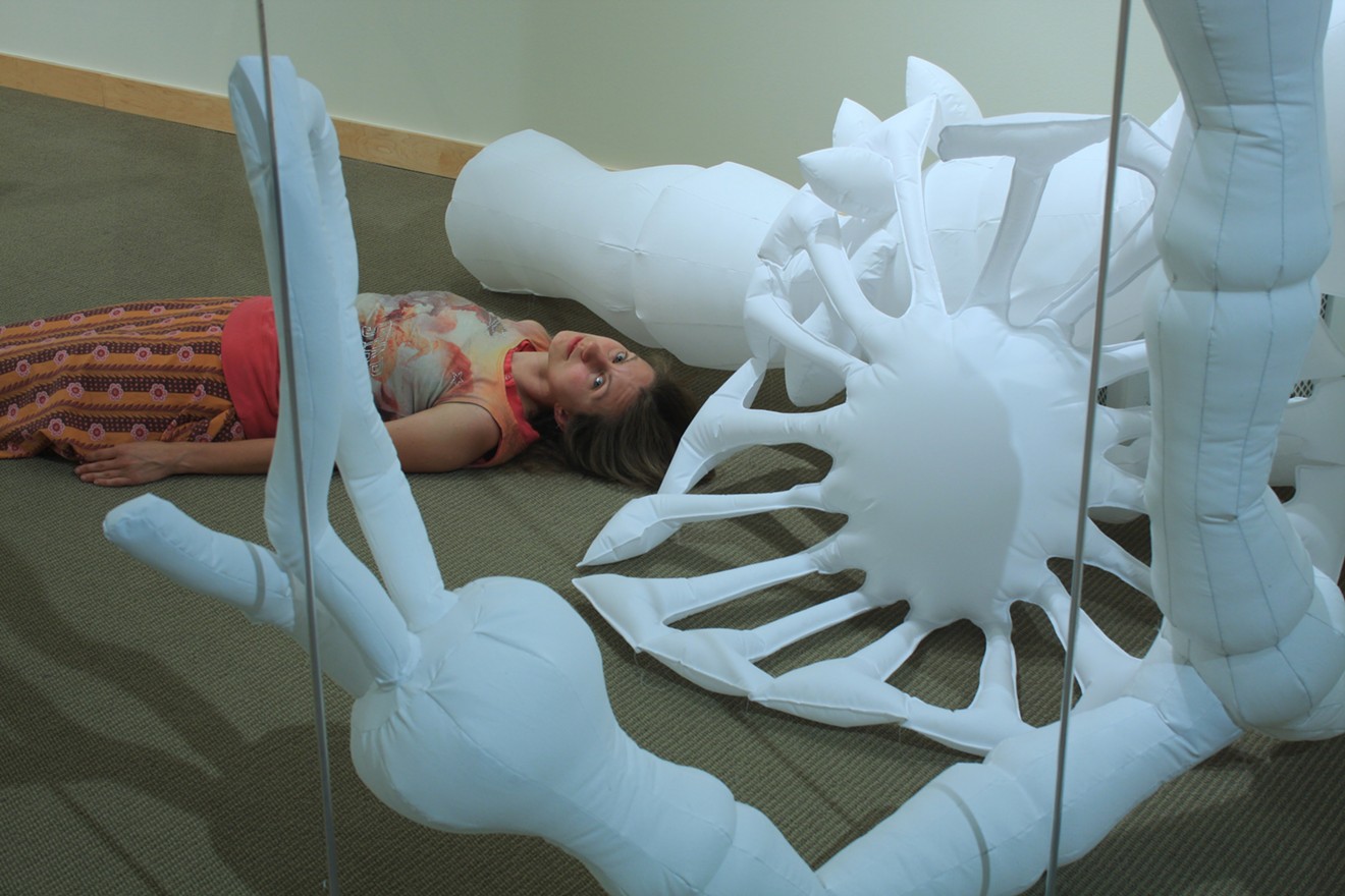 Nicole Banowetz  in her installation "Contagion" at the Museum of Outdoor Arts.