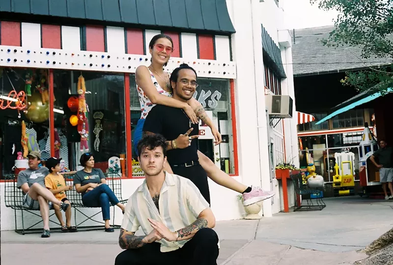 Image: Alexander Ablola, center, with his two favorite humans, Morgan Binder and Caleb Hahne.