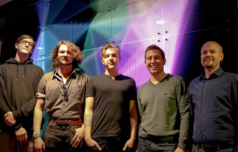 Image: Ethan Bach and the Alt Ethos team 2017 in front of their interactive LED hallway at the Commons on Champa.
