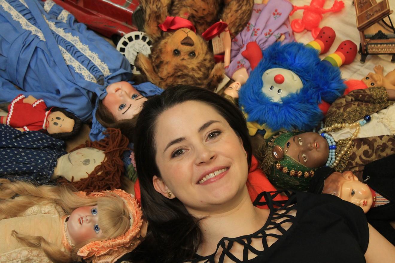 Wendy Littlepage, director of the Denver Museum of Miniatures, Dolls and Toys, poses with part of the collection.