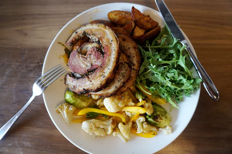 Image: Meat and potatoes don't get much better than the porchetta platter at SK Provisions.