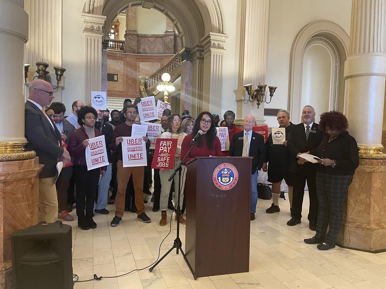 Researcher and part-time rideshare driver Samantha Dalal spoke at a February 20 rally.
