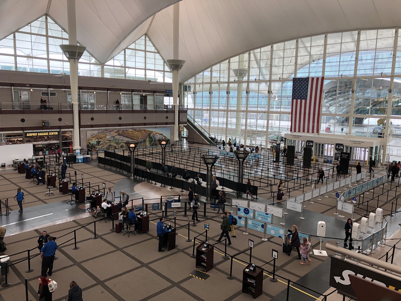 Denver International Airport was largely empty Tuesday morning after a major snowstorm led airlines to cancel at least 477 outbound flights.