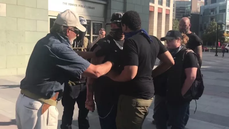 Image: Lee Keltner and Jeremiah Elliott face off shortly before Keltner was fatally shot near the Denver Art Museum on October 10.