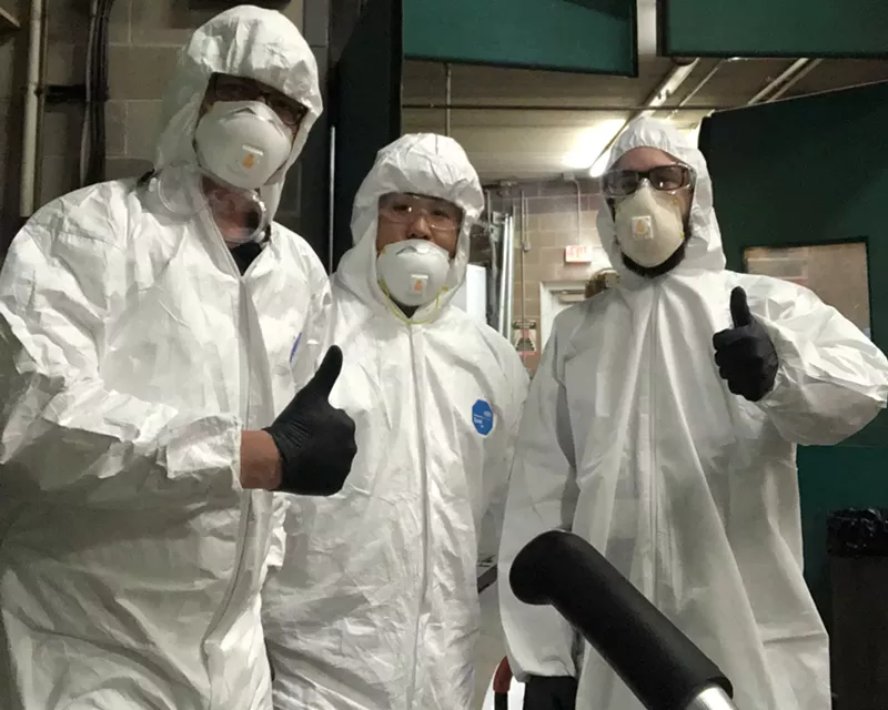 Image: Chef Thach Tran (center) and his team give a thumbs up to getting rid of coronavirus.