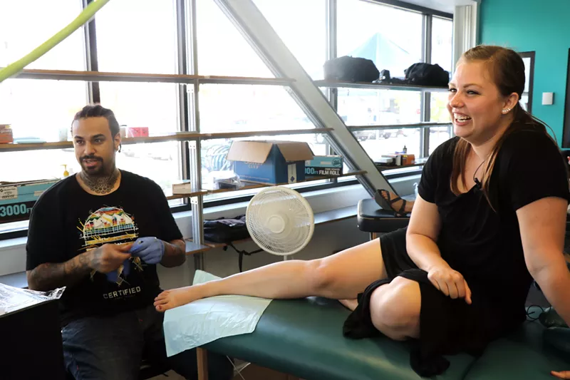 Image: Librarian Melissa Dewitt gets her first tattoo.