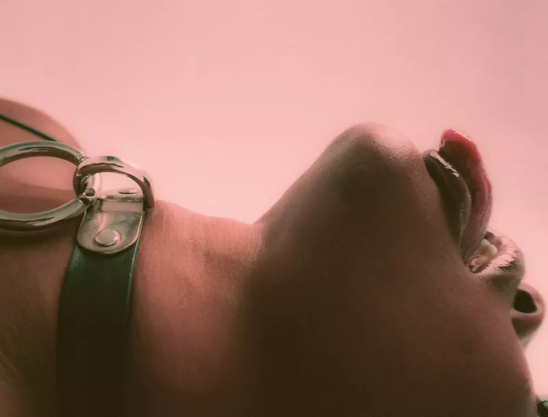 Image: Woman lying down with her tongue out