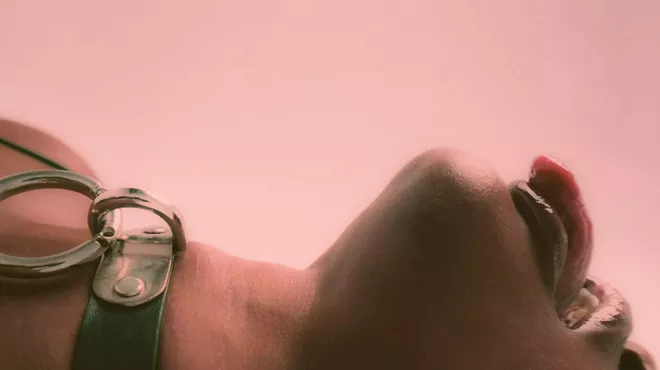 Woman lying down with her tongue out