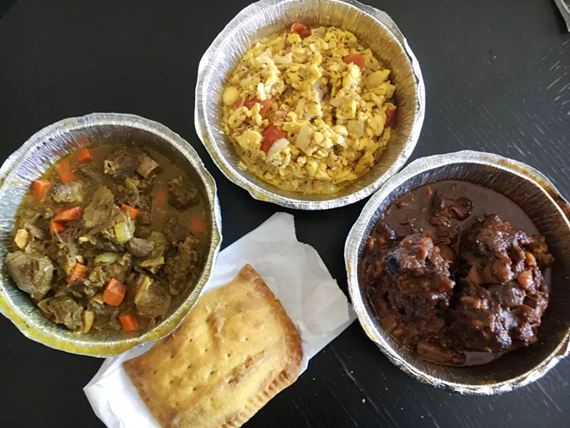 Image: Curry goat, ackee with saltfish, braised oxtail and a patty from Jamaican Jerk & BBQ.