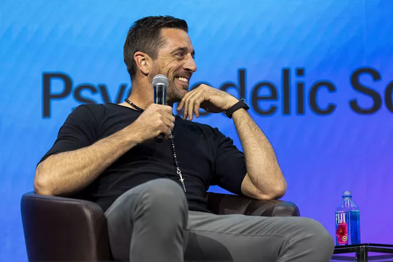 Image: Quarterback Aaron Rodgers speaks at Psychedelic Science 2023 in Denver.