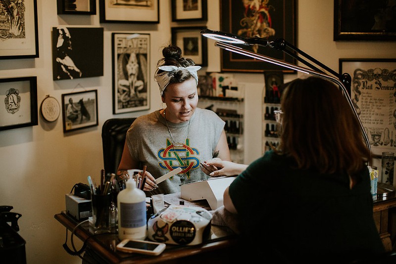Rachael Bowen, who owns Acronychous nail shop in the River North Arts District, preps her client for a manicure.