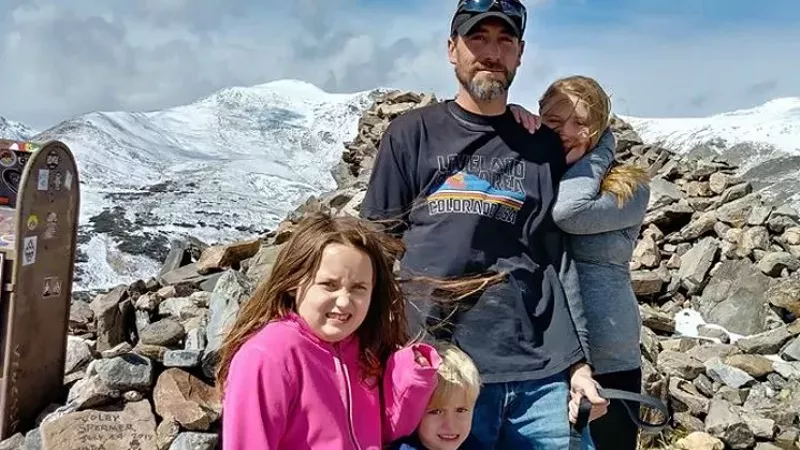 Image: Adam Lee wearing a Loveland T-Shirt while posing with his kids in a photo shared in October 2017.