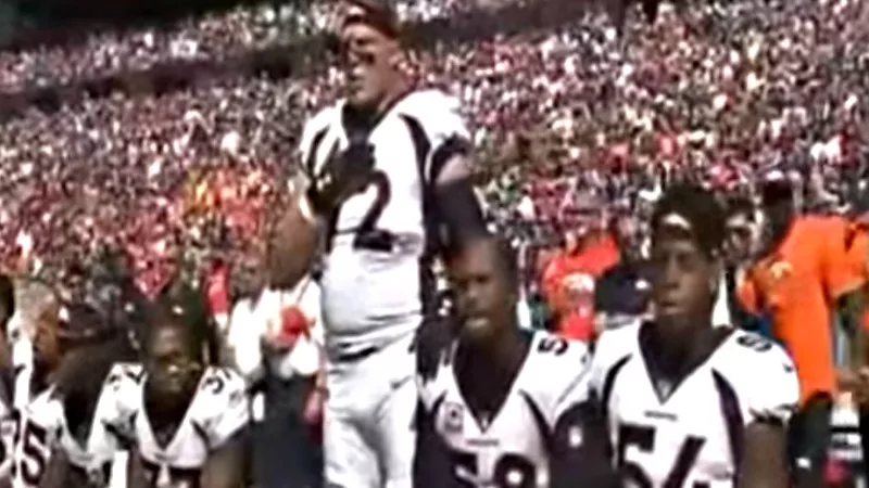 Image: Broncos Von Miller and Brandon Marshall, right, kneeled during the playing of the national anthem at a September game, while Garrett Bolles stood.
