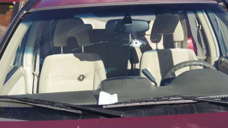 Image: A police officer shot into this vehicle when he saw a juvenile reach for what he thought was a gun. It was a cell phone.