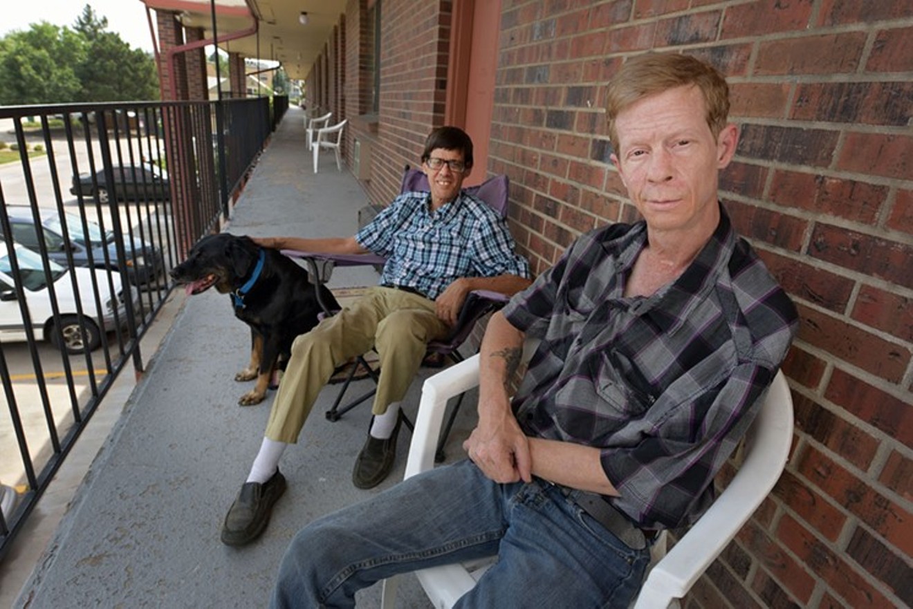 Alan Fantin (right)  and his dog Scooter stayed with friend Mitchel Sparer after he was prohibited from returning to his own home.