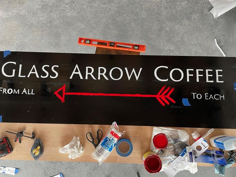Image: Jeff "JJ" Bebout is hand-making the signs for his new Glass Arrow shop.