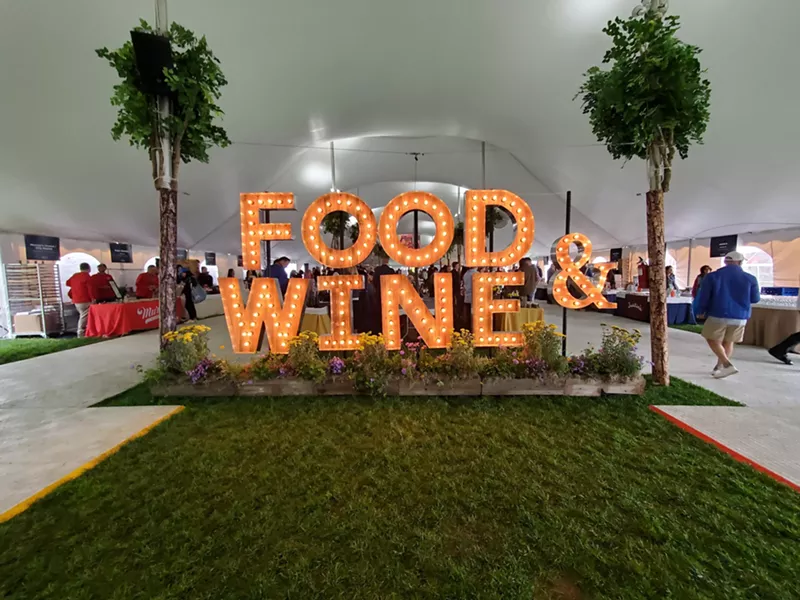 Image: large lit up letters that say "food & wine)