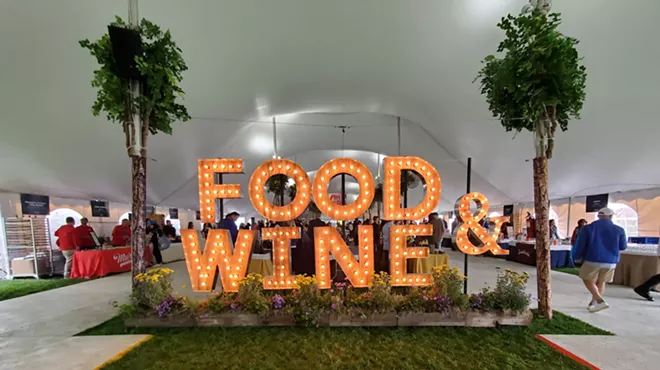 large lit up letters that say "food & wine)