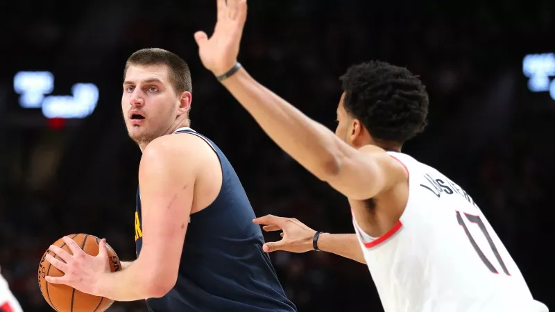 Image: Denver Nuggets center Nikola Jokic looks to pass during the team's 108-100 victory over the Portland Trail Blazers on October 23.