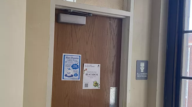 all-gender bathroom door at high school