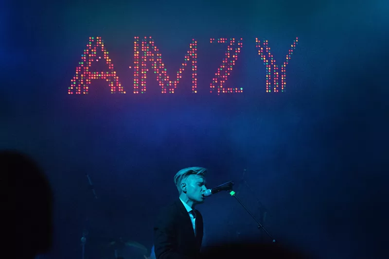 Image: Johnson on stage during an AMZY concert.