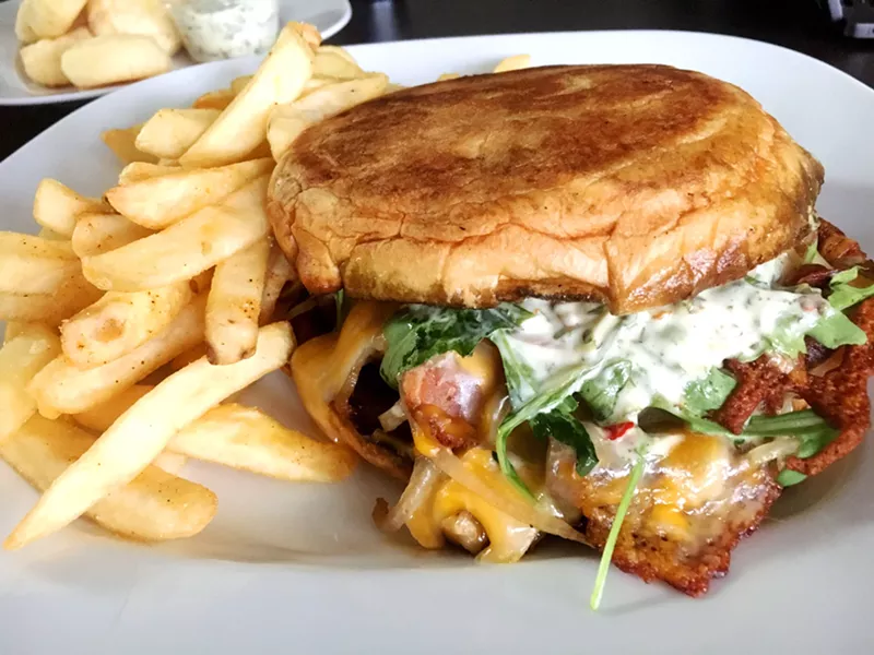 Image: This Brazilian steak sandwich drips with cilantro-garlic sauce and cheese.