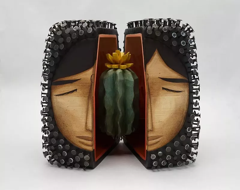 Image: A wood sculpture by Jaime Molina, for Trail Song at the A.R. Mitchell Museum of Western Art in Trinidad.