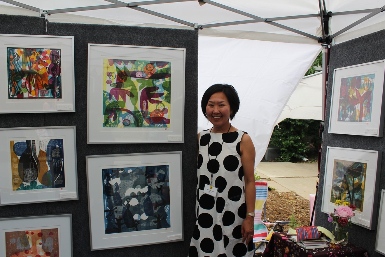 Printmaker Mami Yamamoto shows off her booth at the 28th annual Summer Art Market.