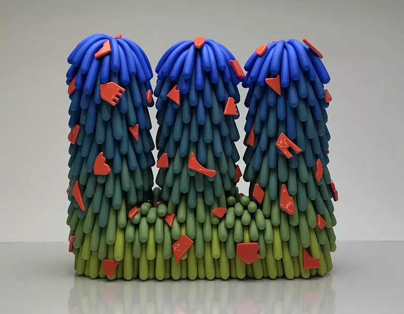 Image: Linda Lopez, "Blue/Green Triple Dust Furry with Red Cutouts," 2019, porcelain.