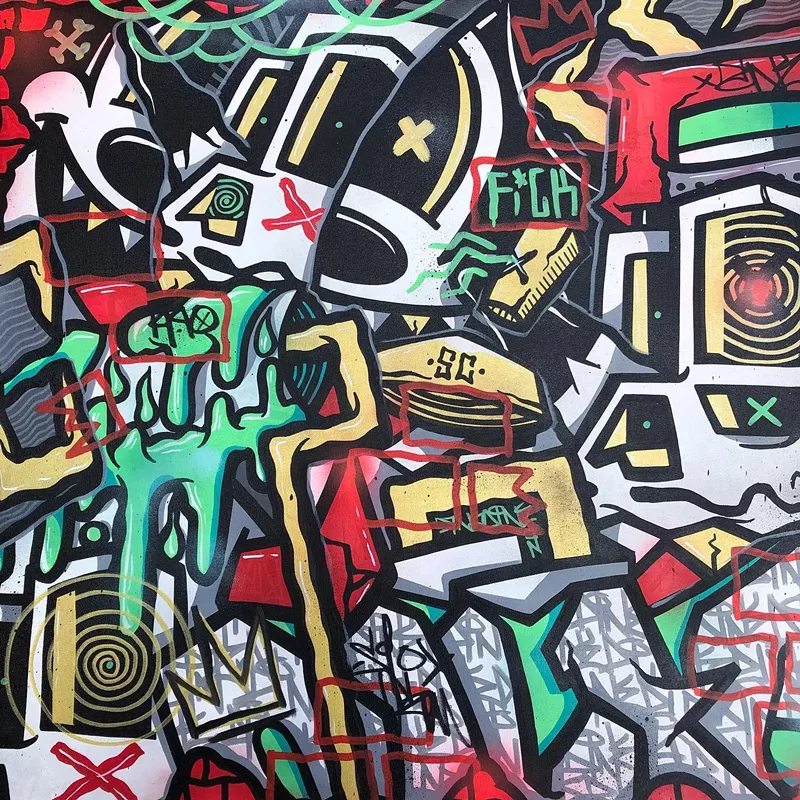 Image: Denver-based street artist DINKC adds his touch to Dateline's Crush Walls show.