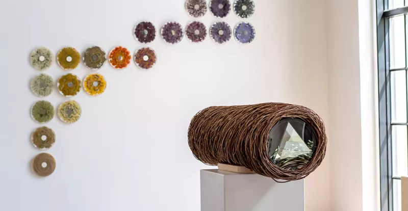 Image: Eileen Richardson's "Echoscope #2," with a wall of acrylic disks.
