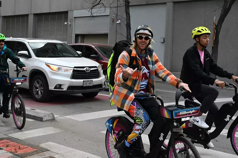 Image: Pat Milbery rides a bike.