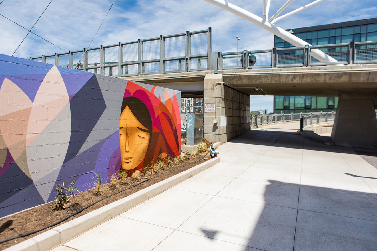 Denver artists Jaime Molina and Pedro Barrios collaborated on a mural depicting neighborhood change in Platte Street Plaza.