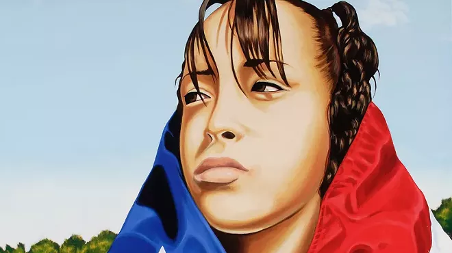 A girl with a flag wrapped on her head