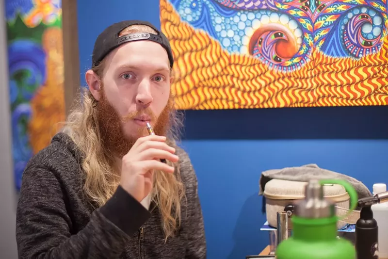 Image: A private marijuana-friendly event takes place at Phil Lewis Art Studio & Gallery in Boulder.