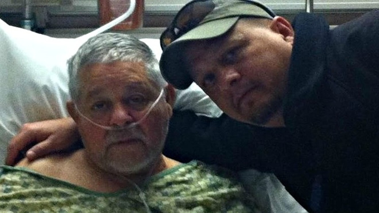 Bobby Espinoza with his father, Jerry, during the latter's final hospitalization, is the lead plaintiff in one of the Sunset Mesa lawsuits.