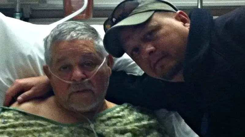 Image: Bobby Espinoza with his father, Jerry, during the latter's final hospitalization, is the lead plaintiff in one of the Sunset Mesa lawsuits.