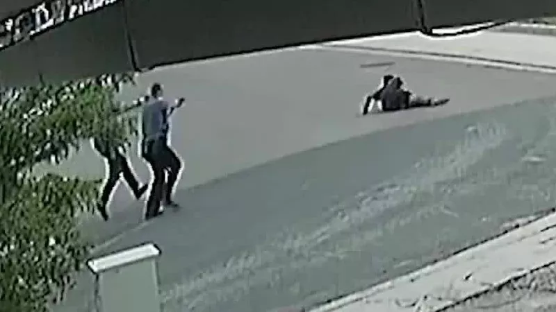 Image: A screen capture from video showing the police shooting of De'Von Bailey.