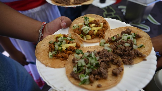 a plate of four street tacos