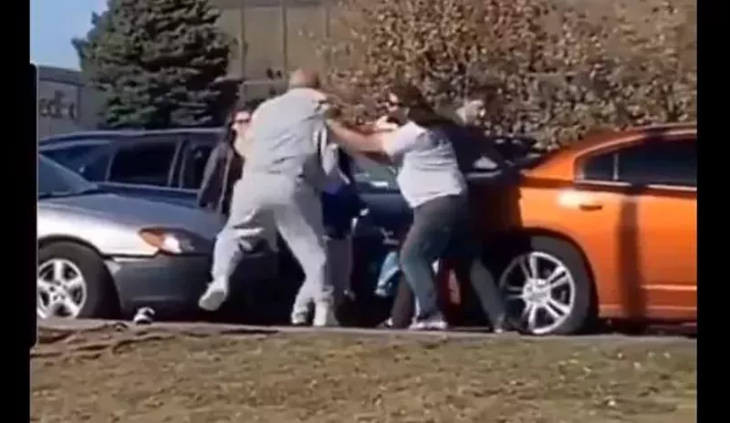 Image: Two adult humans fight each other over In-N-Out Burger.