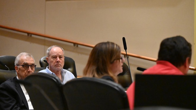 Charlie Richardson, Mark Grueskin and Suzanne Tehari in the Aurora City Council chambers.