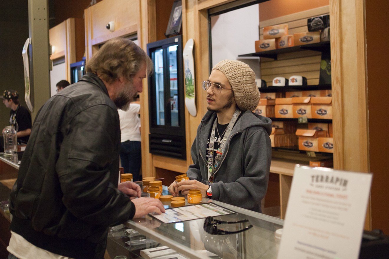 A Terrapin Care Station dispensary budtender helps a customer.