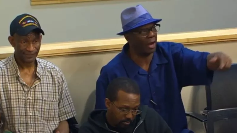 Image: A passionate participant in the April 19 Aurora town hall focused on the consent decree imposed on the Aurora Police Department.