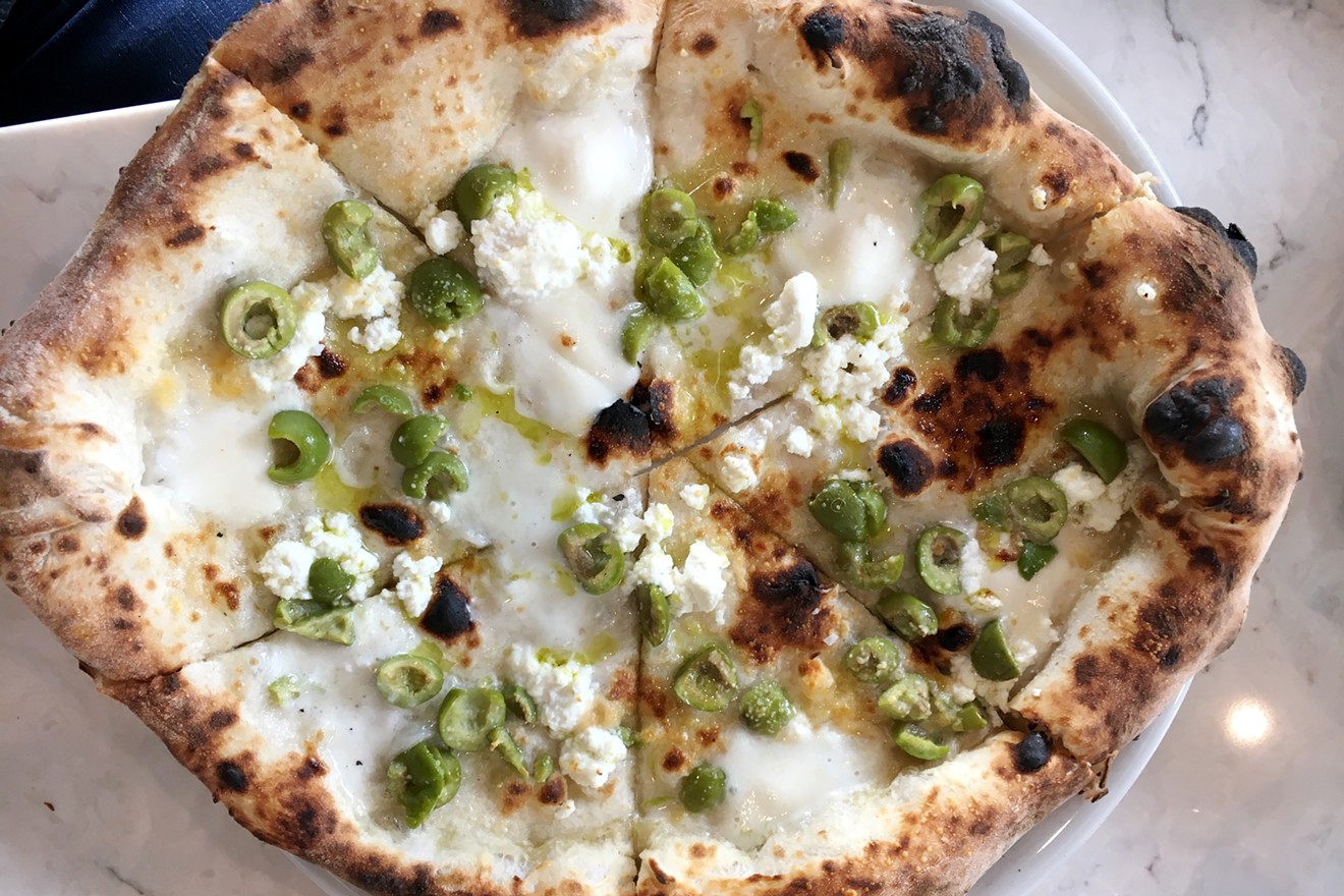 One of the white pies at Babettes — with castelvetrano olives, mozzarella, ricotta and chili flakes.