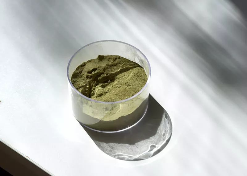 Image: jar of green powdered kratom