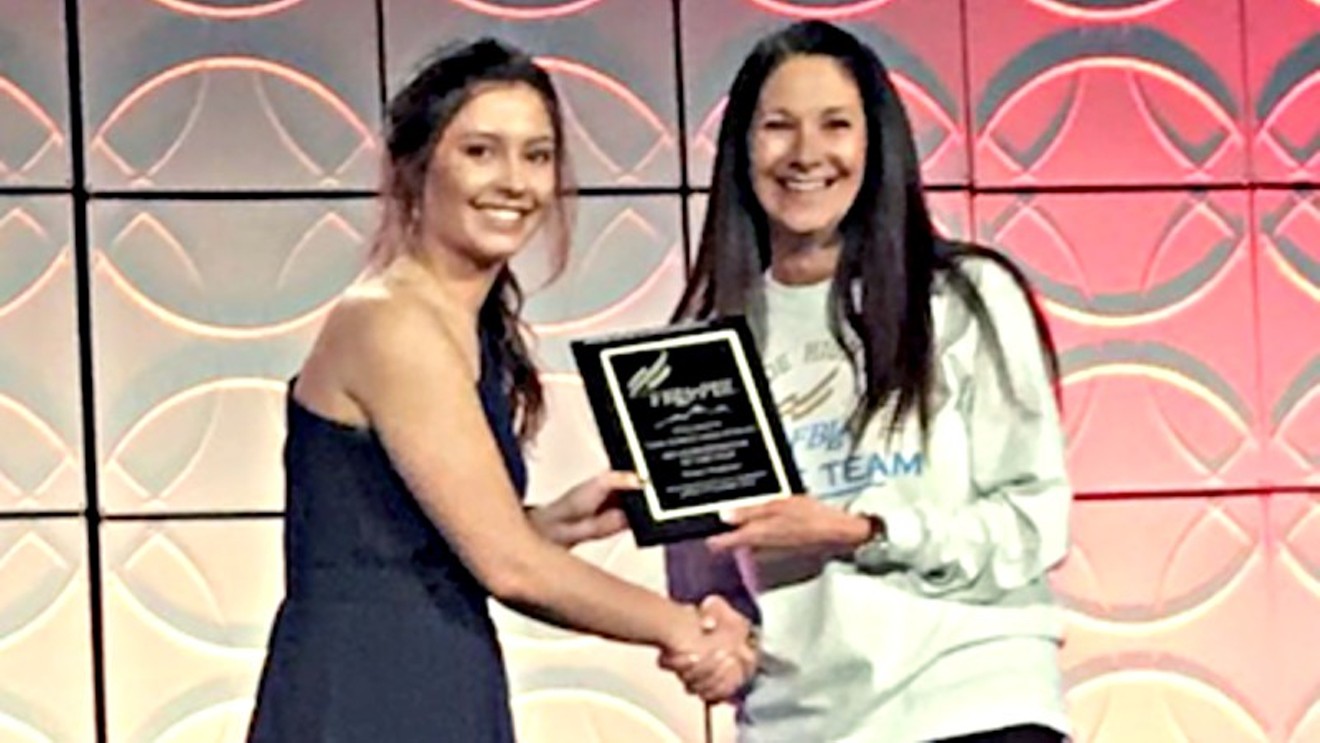 Natalie Pramenko accepting an award as FBLA Administrator of the Year last week.