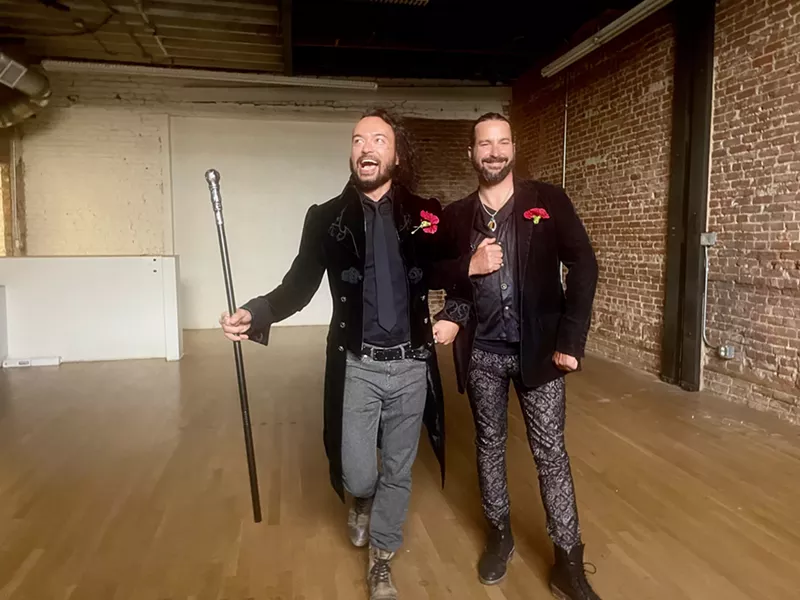 Image: two men in black suits