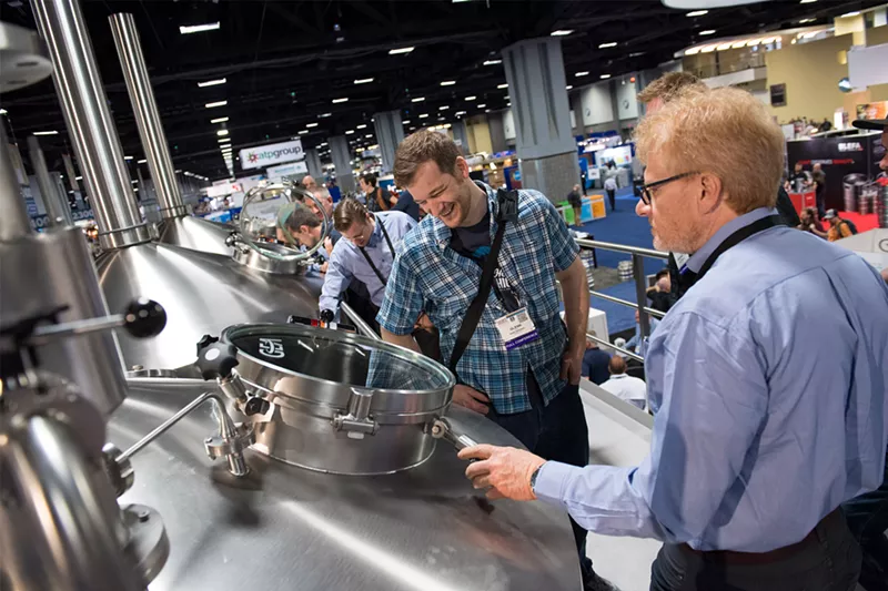 Image: Brewers peruse the wares at the Craft Brewers Conference.
